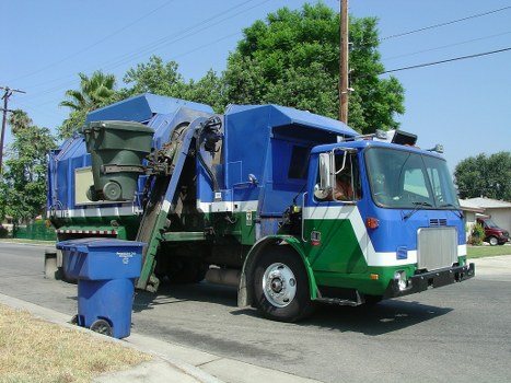 Workers segregating construction waste for recycling